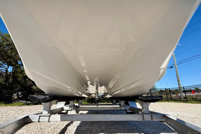 Slide: The Image of Underside view of 2011 Carolina Cat 18 CC boat on trailer, clear sky background. - 34