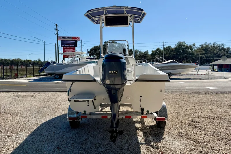 Slide: The Image of 2011 Carolina Cat 18 CC boat with 115 HP engine on display outdoors. - 6