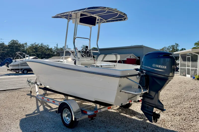 Slide: The Image of 2011 Carolina Cat 18 CC boat with Yamaha outboard motor on a trailer. - 7
