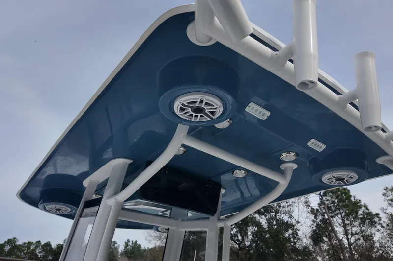 Slide: The Image of 2026 Blazer 2600 Makaira boat with powerful V10 engine, docked on a trailer. - 13