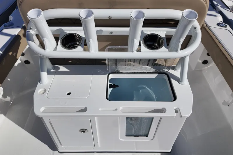 Slide: The Image of 2026 Blazer Bay Makaira 2600 boat console with rod holders and storage compartments. - 14