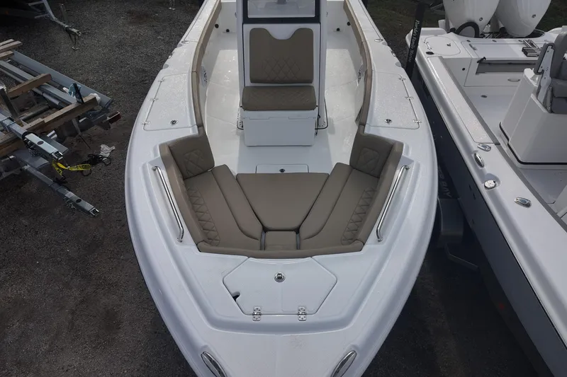 Slide: The Image of 2026 Blazer 2600 Makaira boat on trailer, blue hull, outdoor setting. - 3