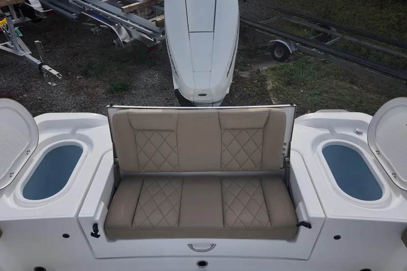 Slide: The Image of 2026 Blazer 2600 Makaira boat with Mercury engine, featuring spacious deck and seating. - 5