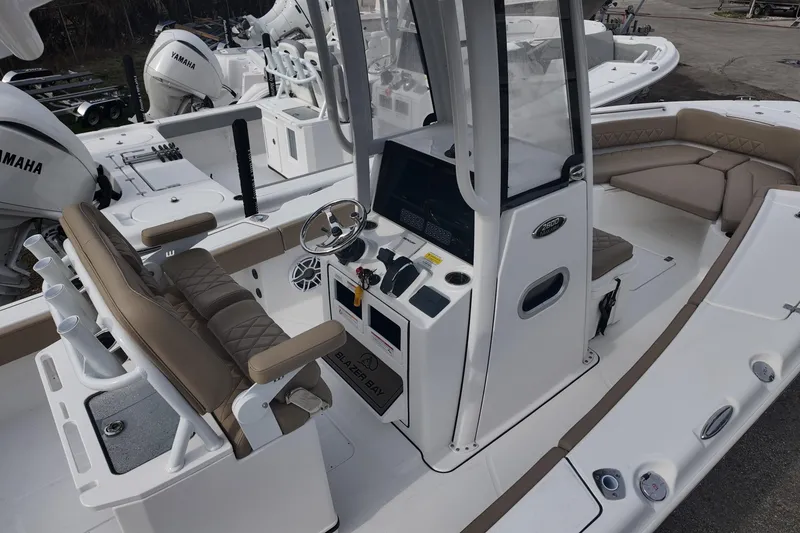 Slide: The Image of 2026 Blazer 2600 Makaira boat with tan seating and spacious deck layout. - 7