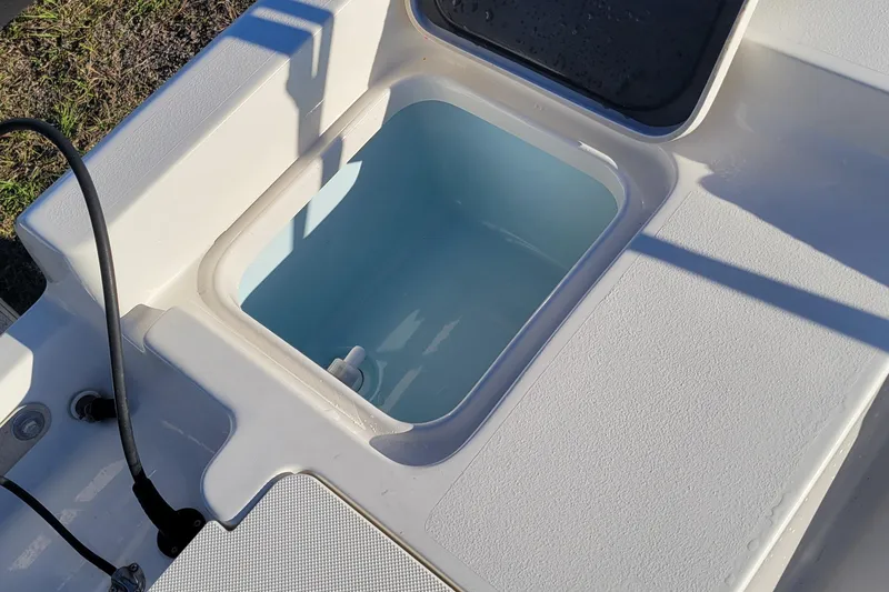 Slide: The Image of Livewell compartment on 2024 Key West 188 Bay Reef boat, open lid view. - 10