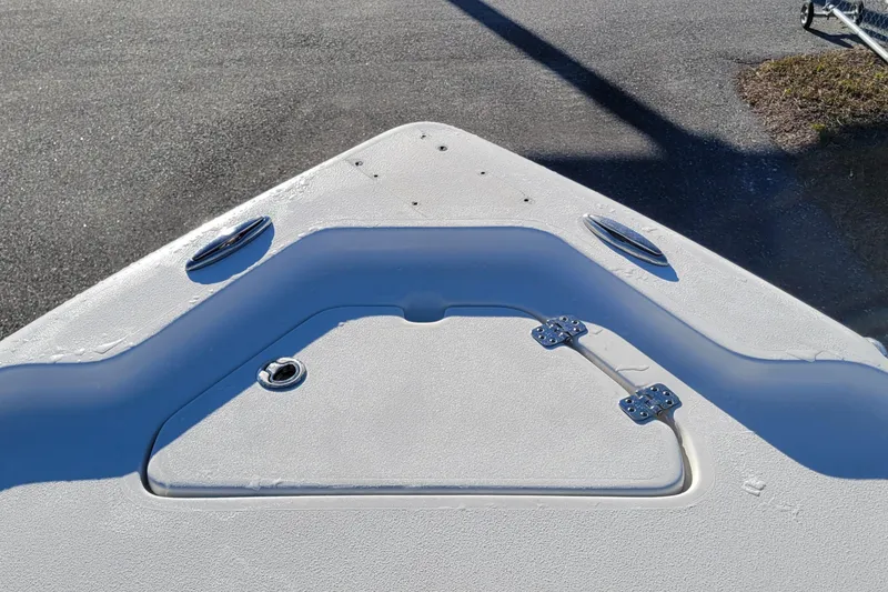 Slide: The Image of 2024 Key West 188 Bay Reef boat deck with storage hatch and cleats. - 11