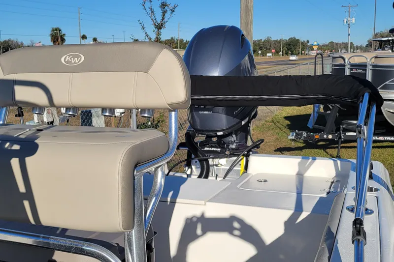 Slide: The Image of 2024 Key West 188 Bay Reef boat with Yamaha engine, featuring comfortable seating and sleek design. - 3