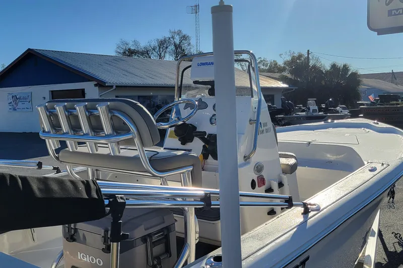 Slide: The Image of 2024 Key West 188 Bay Reef boat with seating and console, parked outdoors. - 6