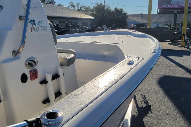 Slide: The Image of 2024 Key West 188 Bay Reef boat, sleek design, outdoor display, sunny day. - 7