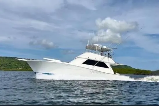The Image of 1996 Viking 50 Sport Fisher Convertible yacht cruising on calm waters. - 0