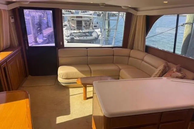 Slide: The Image of 1996 Viking 50 Sport Fisher Convertible cruising on open water. - 11