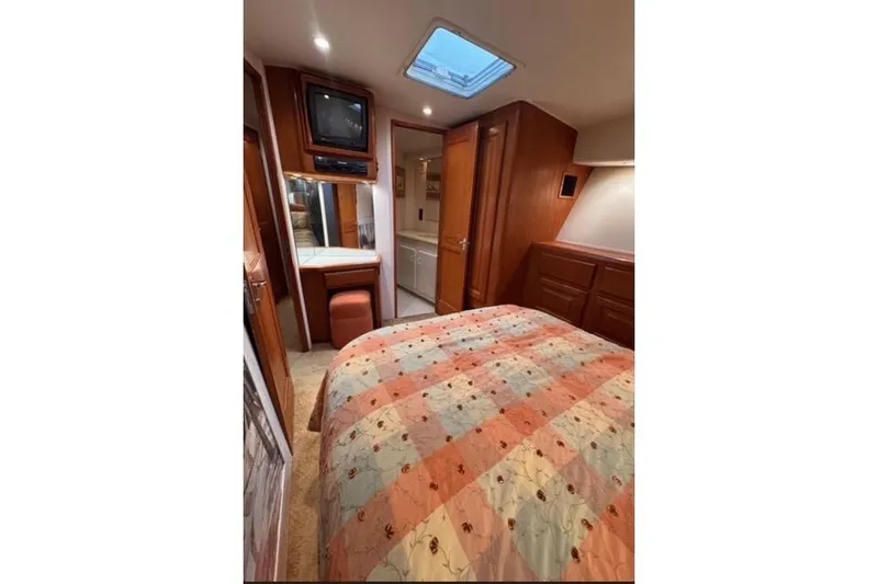 Slide: The Image of A 1996 Viking 50 Sport Fisher cruising swiftly on open water. - 14