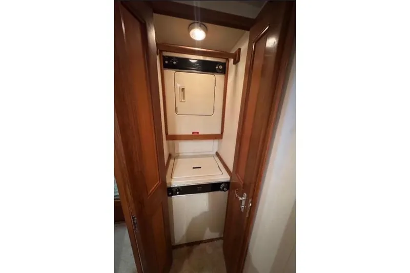 Slide: The Image of 1996 Viking 50 Sport Fisher Convertible cruising on open water. - 17