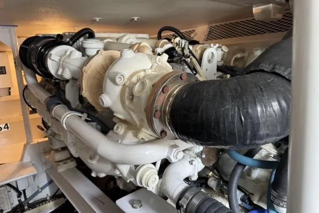 Slide: The Image of 1996 Viking 50 Sport Fisher Convertible cruising on open water. - 20