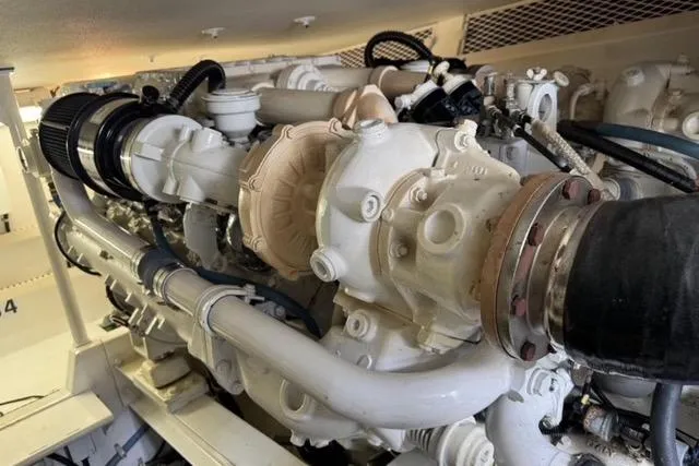 Slide: The Image of 1996 Viking 50 Sport Fisher Convertible cruising on open water, creating a wake. - 21