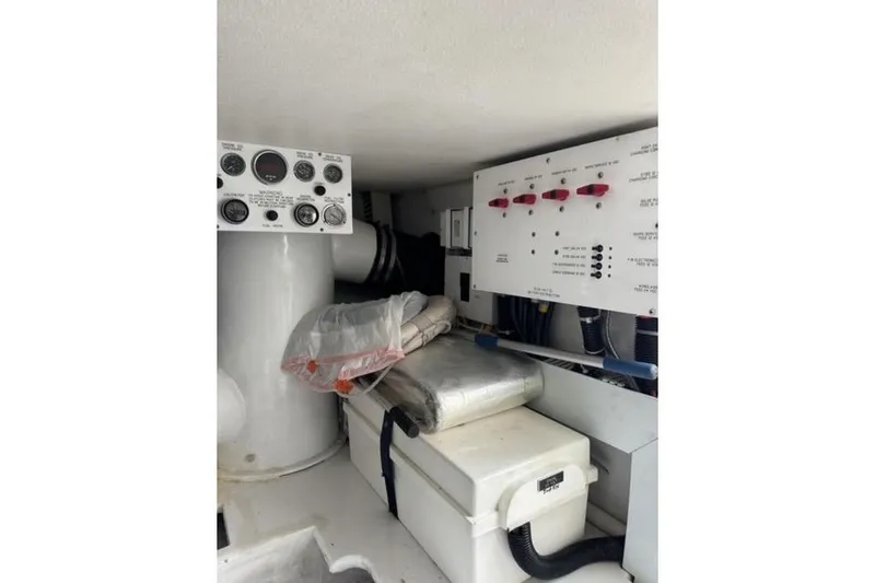 Slide: The Image of 1996 Viking 50 Sport Fisher Convertible cruising on open water under a cloudy sky. - 24