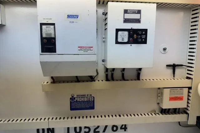 Slide: The Image of 1996 Viking 50 Sport Fisher Convertible cruising on open water. - 26