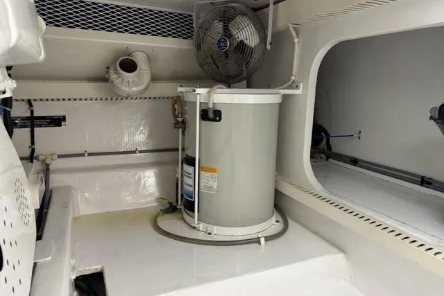 Slide: The Image of 1996 Viking 50 Sport Fisher Convertible cruising on open water, creating a dynamic wake. - 27