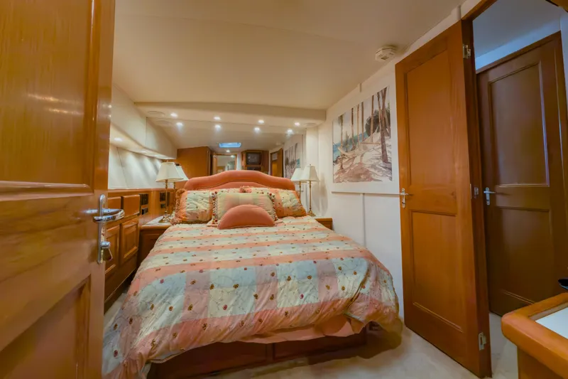 Slide: The Image of Luxurious bedroom interior of 1996 Viking 50 Sport Fisher yacht with cozy bedding. - 39