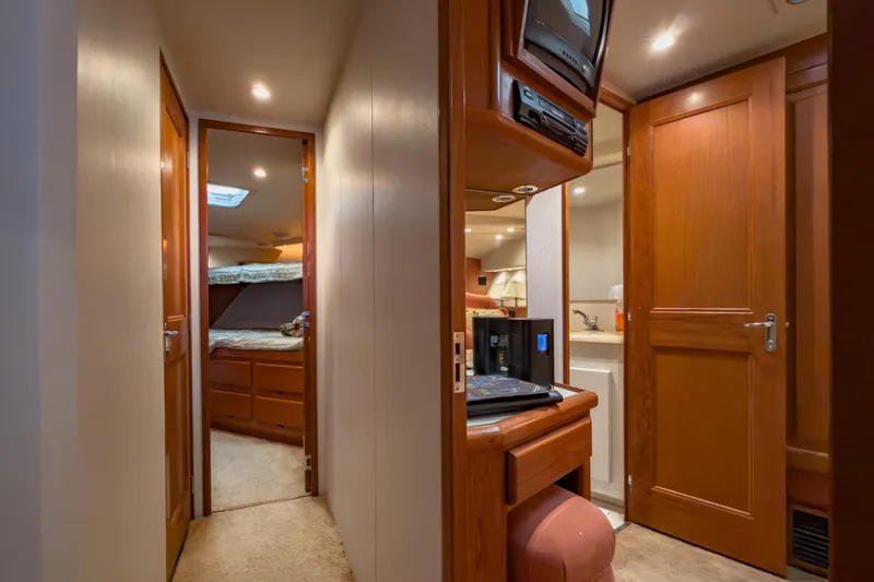 Slide: The Image of Interior of 1996 Viking 50 Sport Fisher yacht with wood paneling and cozy cabin. - 42