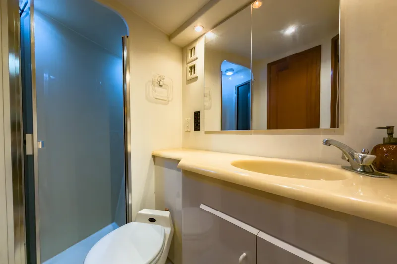 Slide: The Image of Bathroom interior of 1996 Viking 50 Sport Fisher Convertible yacht, featuring shower and sink. - 44