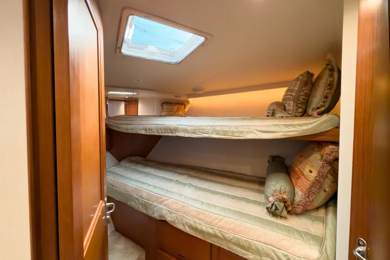 Slide: The Image of Cozy bunk beds in 1996 Viking 50 Sport Fisher yacht cabin. - 45