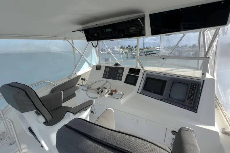 Slide: The Image of 1996 Viking 50 Sport Fisher Convertible yacht helm with modern controls and panoramic view. - 46