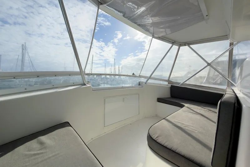 Slide: The Image of Interior view of 1996 Viking 50 Sport Fisher Convertible yacht with cushioned seating. - 51