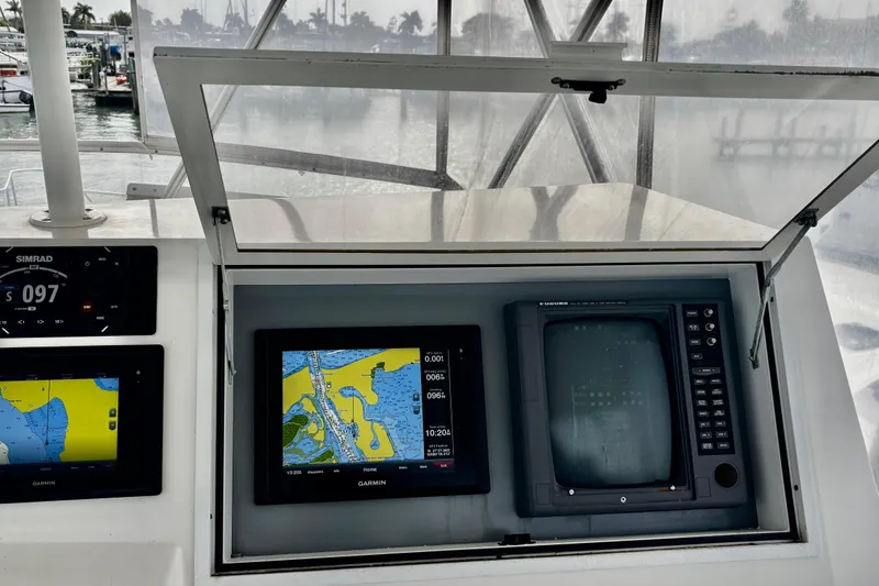 Slide: The Image of Navigation equipment on a 1996 Viking 50 Sport Fisher Convertible boat. - 56