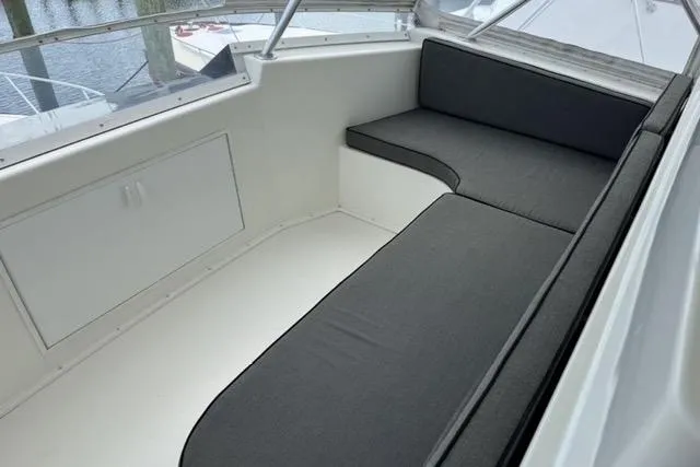 Slide: The Image of 1996 Viking 50 Sport Fisher Convertible cruising on open water, creating a dynamic wake. - 7