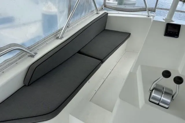 Slide: The Image of 1996 Viking 50 Sport Fisher Convertible cruising on open water, rear view. - 8