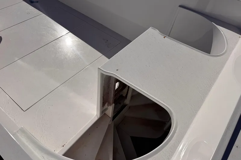 Slide: The Image of White deck of 2025 Don Smith Custom 55' boat with storage compartment. - 11