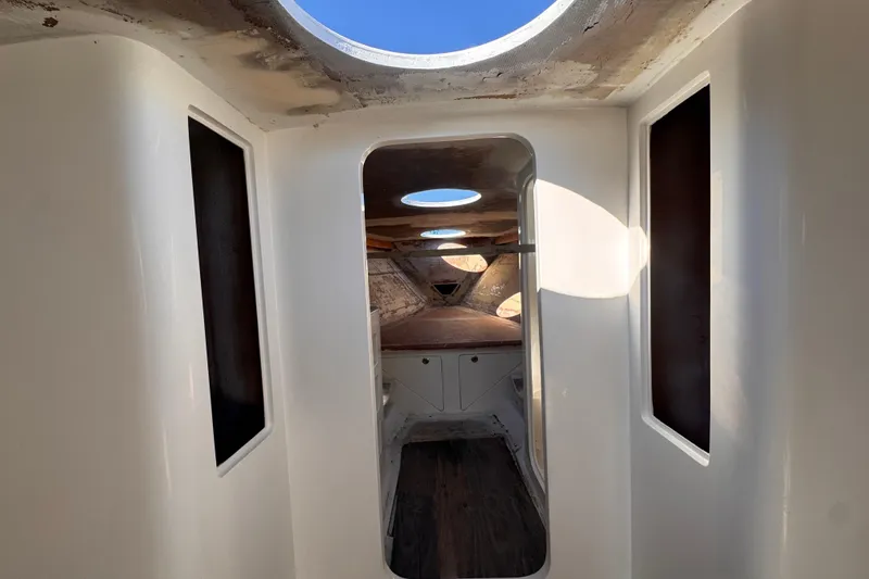 Slide: The Image of Interior view of 2025 Don Smith Custom 55' yacht, featuring sleek design and natural lighting. - 18