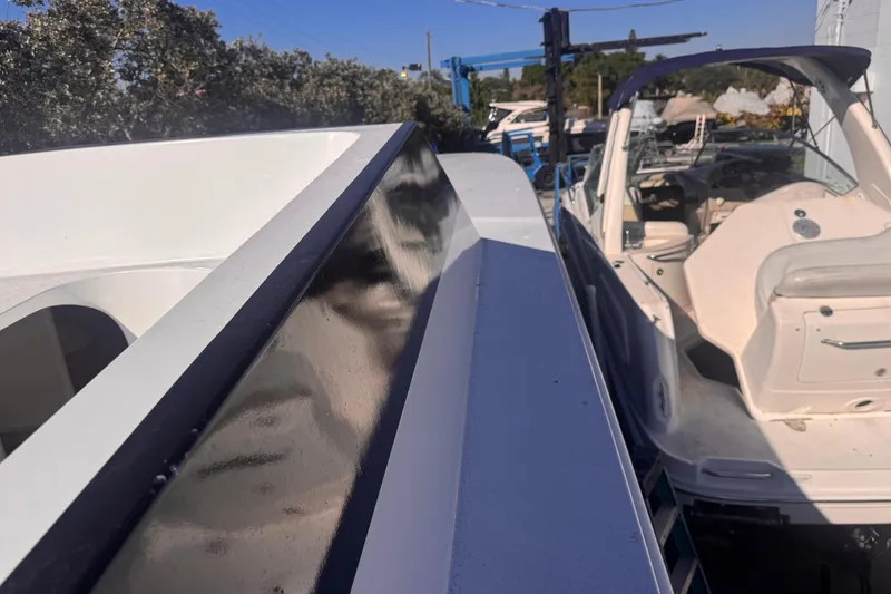 Slide: The Image of 2025 Don Smith Custom 55' yacht docked beside another boat. - 26