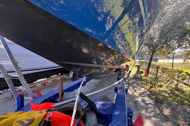 Slide: The Image of 2025 Don Smith Custom 55' boat on trailer, outdoor setting, partial view. - 28