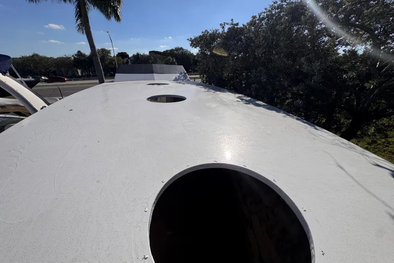 Slide: The Image of Top view of a 2025 Don Smith Custom 55' boat deck under clear blue sky. - 7