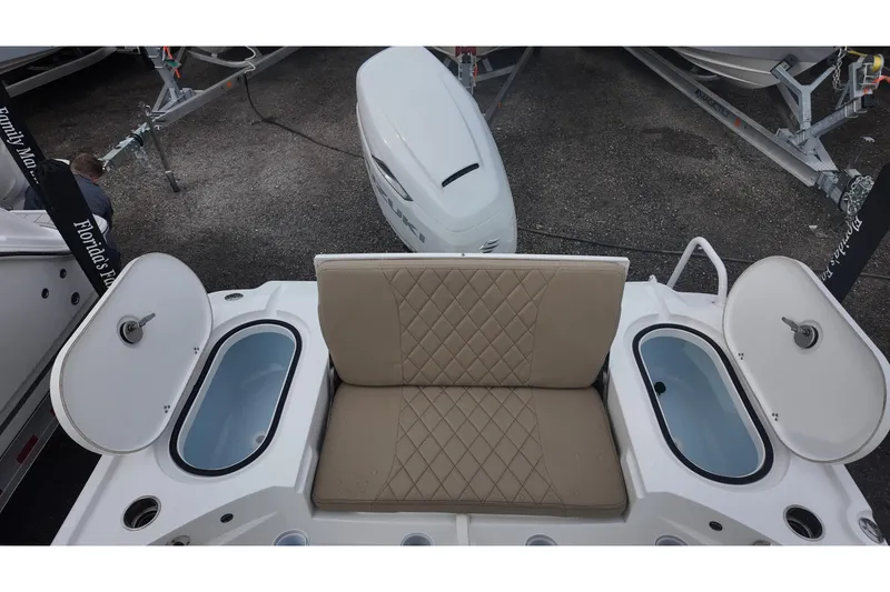 Slide: The Image of 2026 Blazer Bay 2440 boat interior with open storage compartment and wiring. - 12