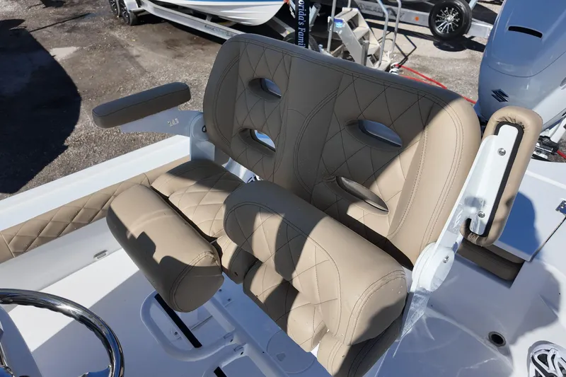 Slide: The Image of 2026 Blazer Bay 2440 boat seat with beige diamond-stitched upholstery and armrests. - 14
