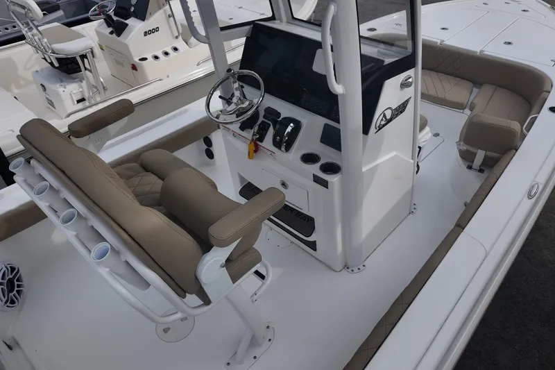 Slide: The Image of 2026 Blazer Bay 2440 boat with beige seating and modern console design. - 5