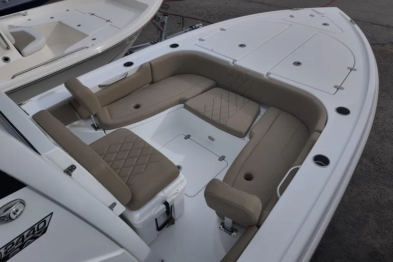 Slide: The Image of 2026 Blazer Bay 2440 boat dashboard with steering wheel, controls, and touchscreen display. - 6