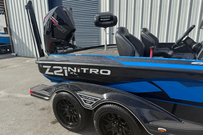 Slide: The Image of 2024 Nitro Z21 XL Pro boat with sleek blue and black design. - 1