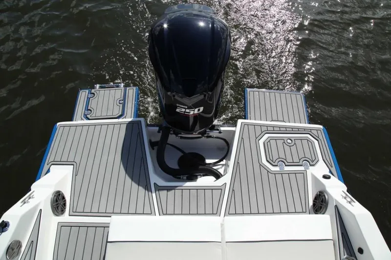 Slide: The Image of 2024 Starcraft 231 SVX boat stern with outboard motor on water. - 19