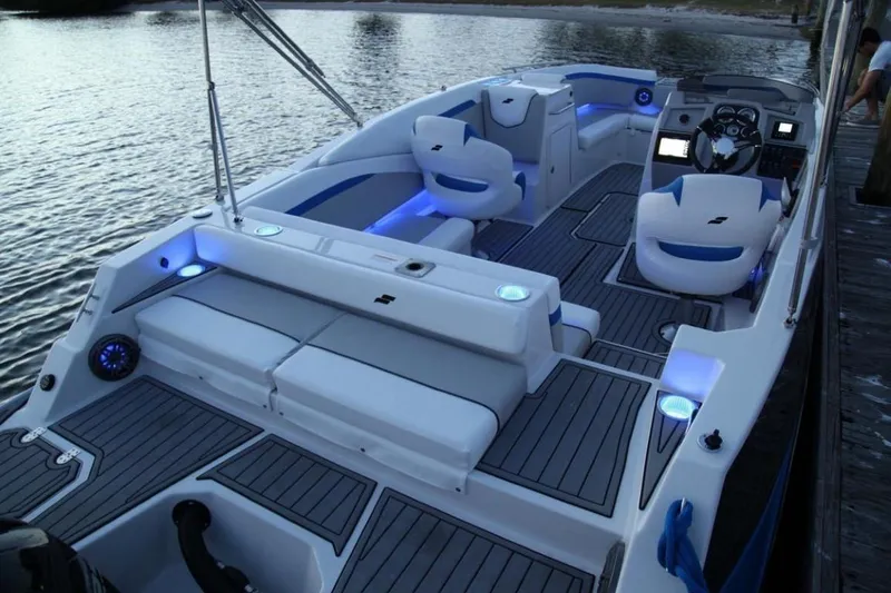 Slide: The Image of 2024 Starcraft 231 SVX boat interior with LED lighting and modern seating. - 6