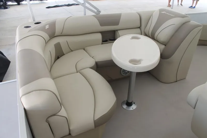 Slide: The Image of 2023 Starcraft EX 18 boat interior with beige seating and round table. - 16