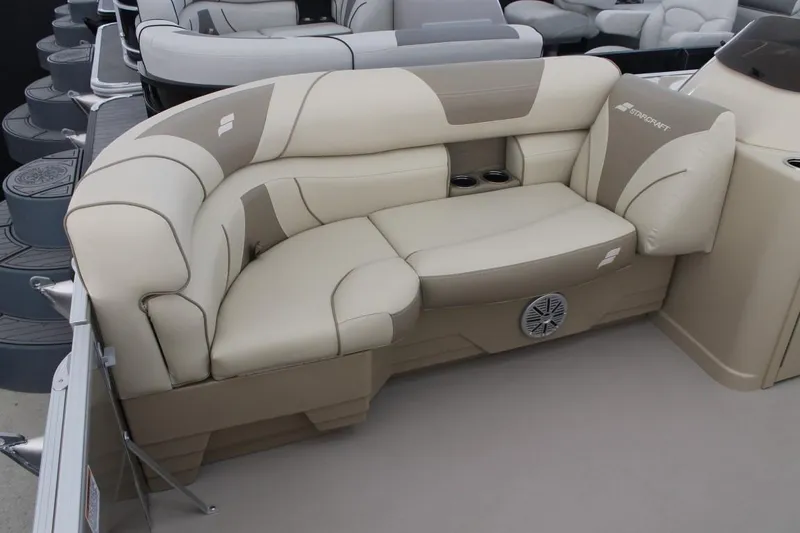Slide: The Image of 2023 Starcraft EX 18 boat interior with beige and tan cushioned seating. - 5