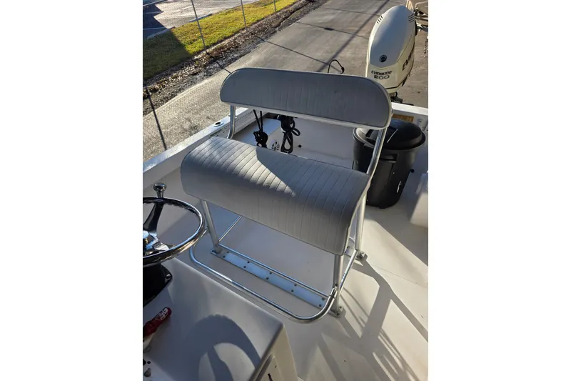 Slide: The Image of Dusky 203 boat interior with steering wheel and seating, 2005 model. - 13