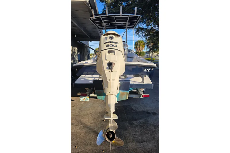 Slide: The Image of Rear view of a 2005 Dusky 203 boat with Evinrude 200 outboard motor. - 17