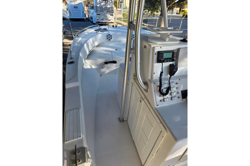 Slide: The Image of 2005 Dusky 203 boat interior with control panel and seating area. - 7