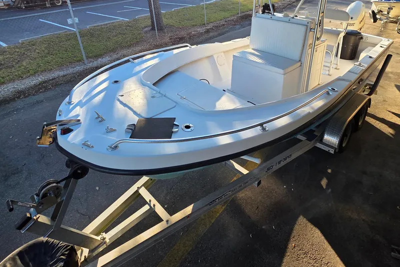 Slide: The Image of 2005 Dusky 203 boat on trailer, parked outdoors in sunlight. - 3