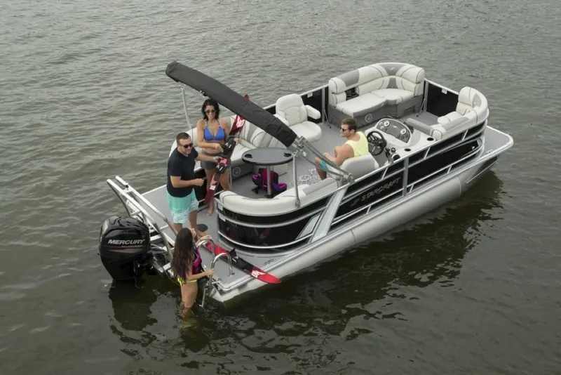 Slide: The Image of 2023 Starcraft EX 24 pontoon boat with people enjoying on the water. - 3